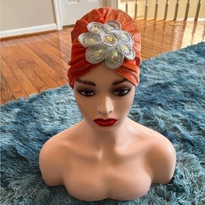 Elegant Orange Turban with Embellished Flower